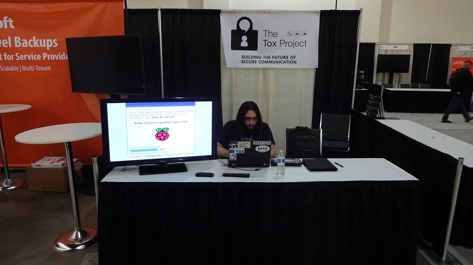 Setting up the booth before the expo floor opens to the conference-goers