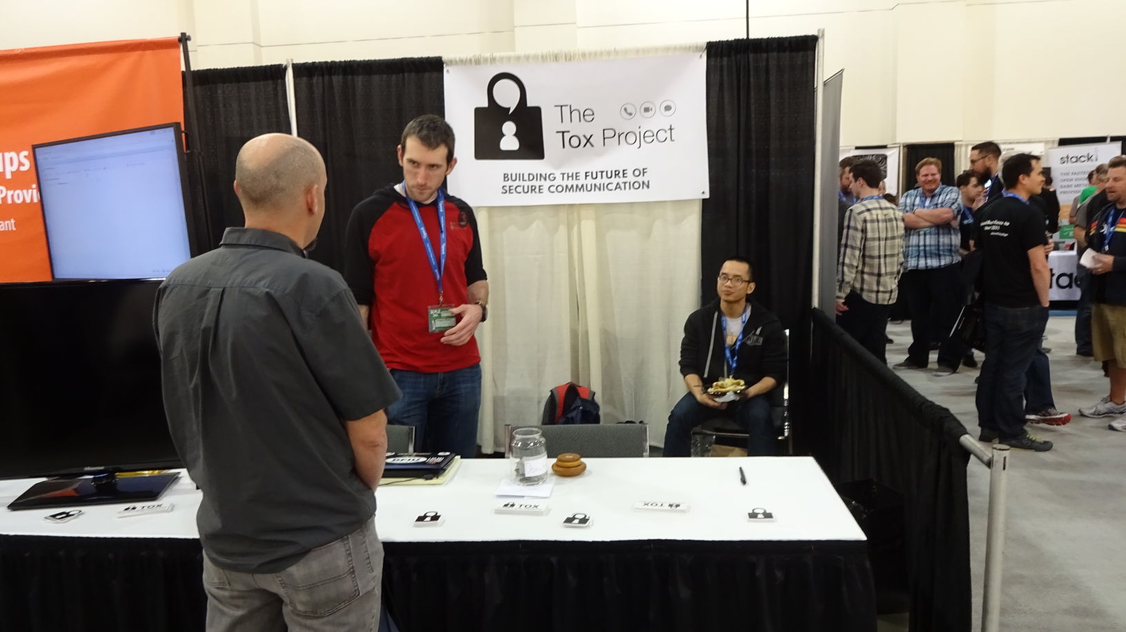 Greg Mullen (left) and Chuong Vu (right) explaining Tox to an expo attendee